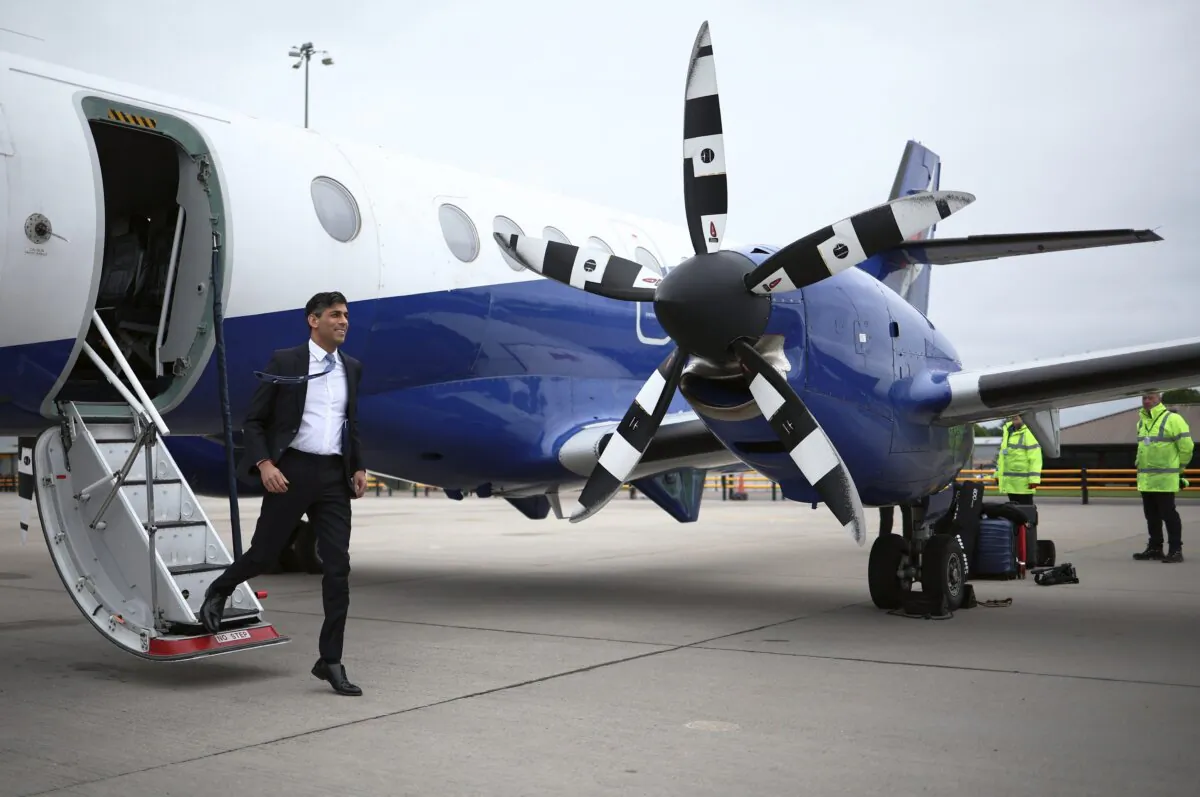 Britain's Prime Minister and Conservative Party leader Rishi Sunak disembarks from his plane, ahead of a campaign event in the build-up to the UK general election, at Inverness Airport in northeast Scotland on May 23, 2024. (Henry Nicholls/POOL/AFP via Getty Images)