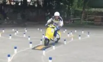 Man Competes in Scooter Competition