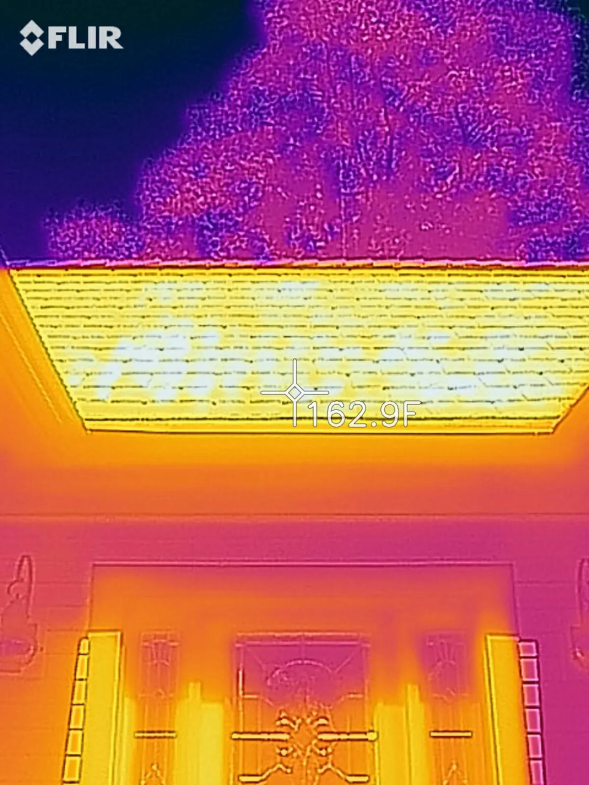 As seen in this infrared camera image, the infrared rays from the sun are cooking my roof shingles like you'd fry an egg in a pan. (Tim Carter/Tribune Content Agency/TNS)
