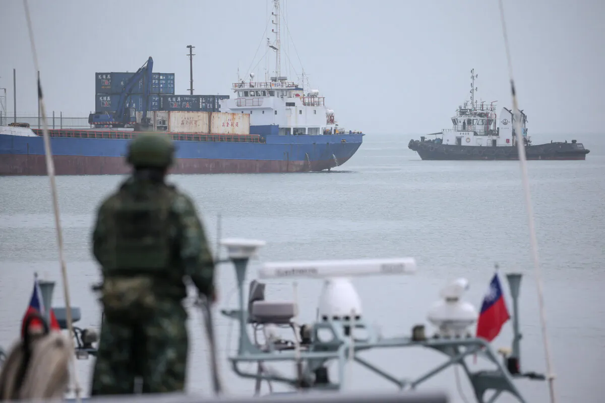 A member of Taiwan's military (front) takes part in routine exercises at Liaoluo Port in Kinmen on May 24, 2024. (I-Hwa Cheng /AFP via Getty Images)