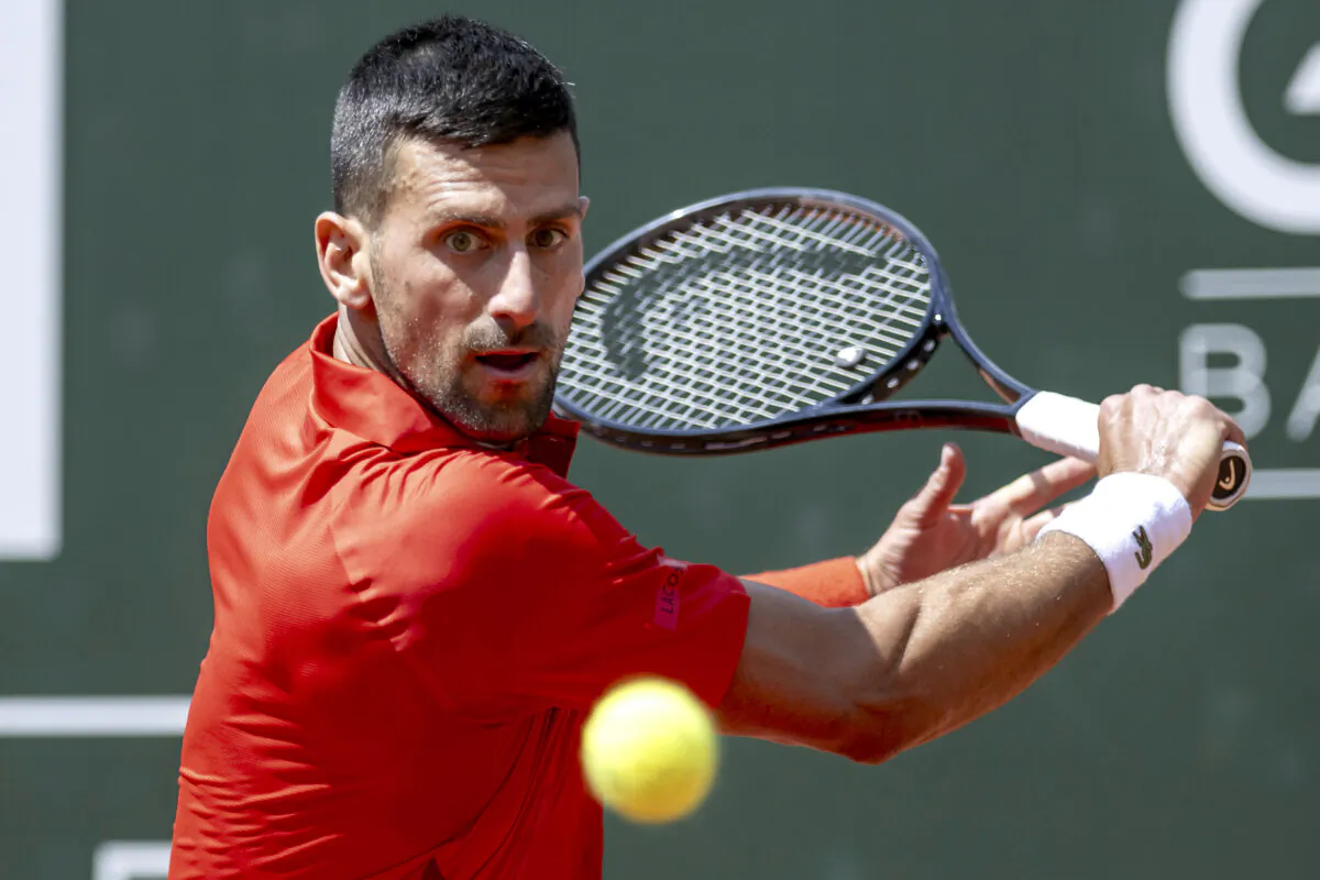 Novak Djokovic of Serbia returns a ball to Tomas Machac of the Czech Republic during their semifinal match at the ATP 250 Geneva Open tennis tournament in Geneva, Switzerland, on May 24, 2024. (Martial Trezzini/Keystone via AP)