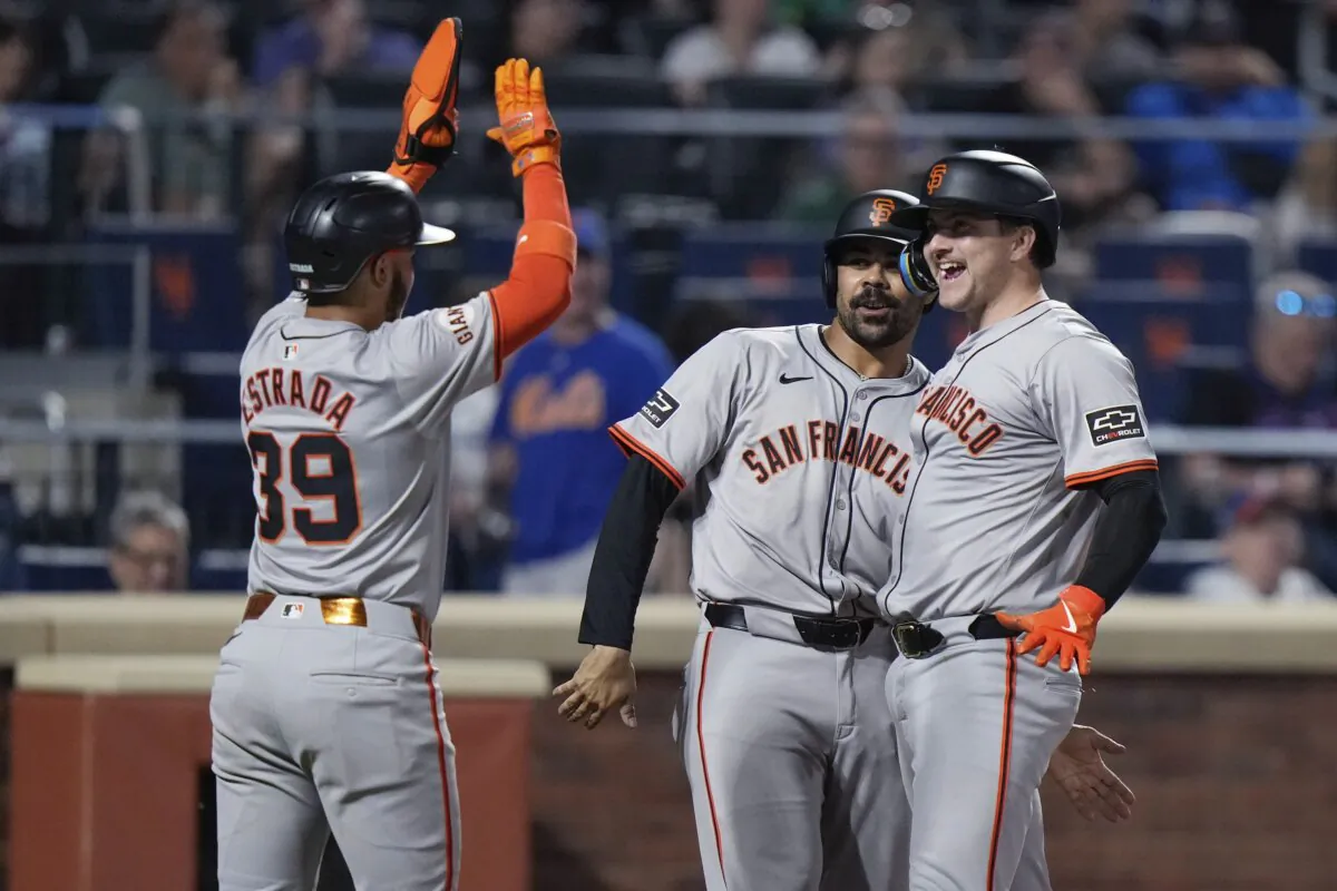 San Francisco Giants' Patrick Bailey (R) celebrates with LaMonte Wade Jr., center, and Thairo Estrada after hitting a grand slam against the New York Mets during the eighth inning of a baseball game in New York, on May 24, 2024. (Frank Franklin II/AP Photo)