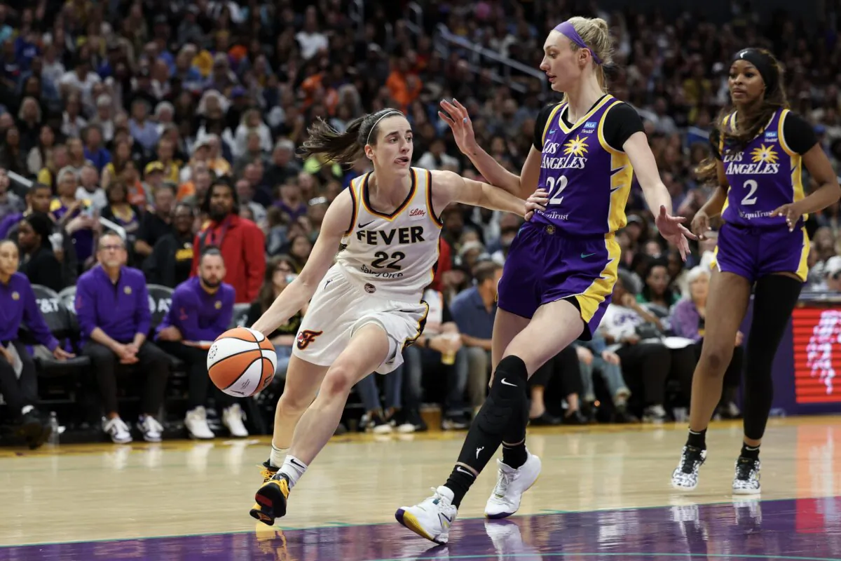 Caitlin Clark (22) of the Indiana Fever drives to the basket against Cameron Brink (22) of the Los Angeles Sparks during the fourth quarter in Los Angeles on May 24, 2024. (Harry How/Getty Images)