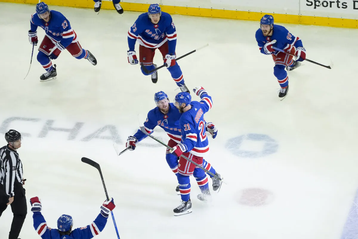New York Rangers center Barclay Goodrow (21) celebrates with teammates after scoring the game-winning goal against the Florida Panthers in overtime in New York on May 24, 2024. (Julia Nikhinson/AP photo)