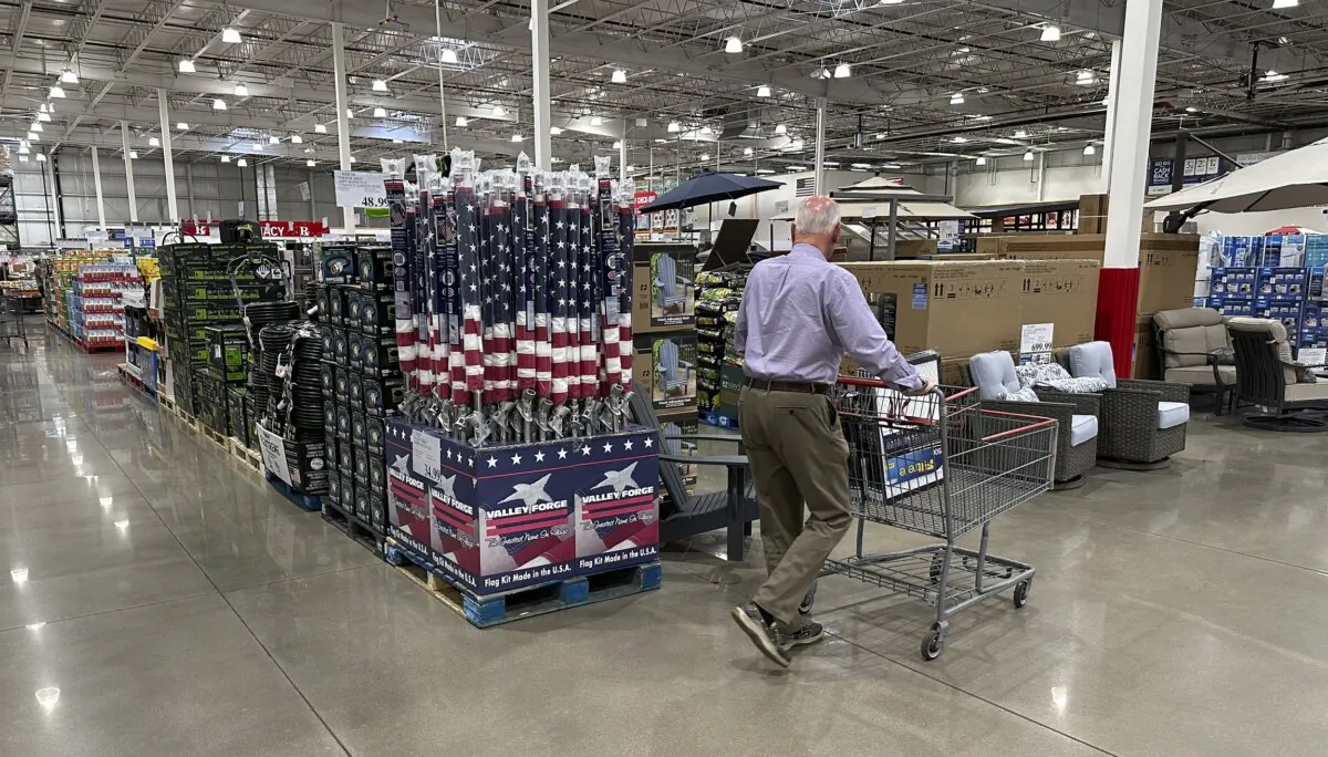 A shopper moves past a display of items in a Costco warehouse in Sheridan, Colo., on May 18, 2024. (David Zalubowski/AP Photo)