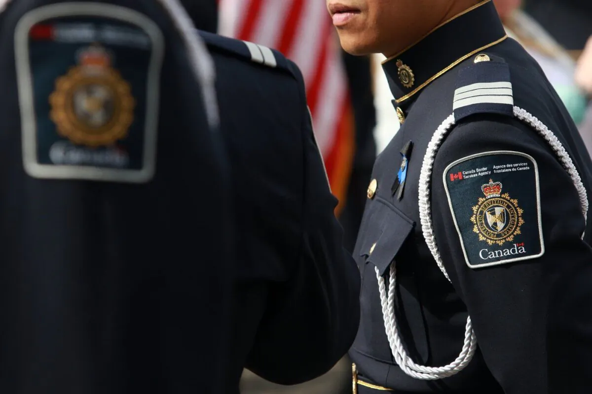 A Canada Border Service Agency member looks on before a ceremony at the legislature in Victoria, Sept. 24, 2023. (The Canadian Press/Chad Hipolito)
