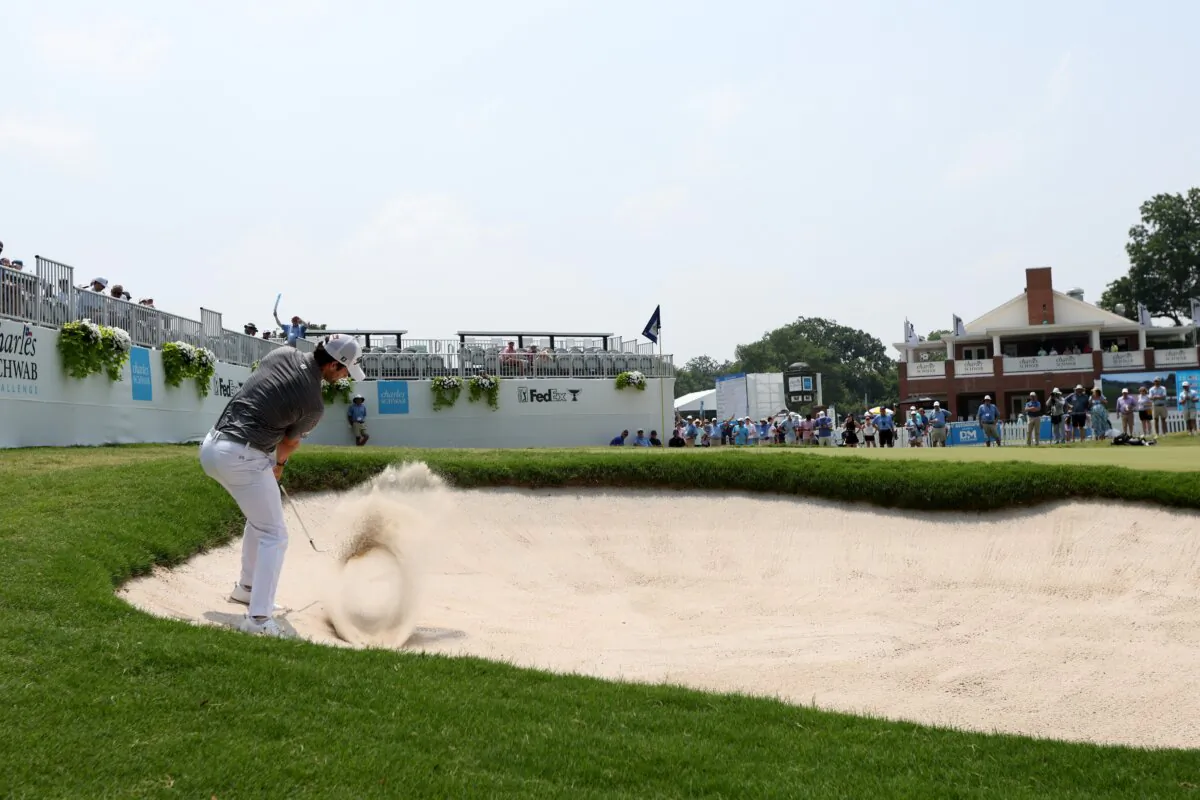 Davis Riley of the United States plays a shot from a bunker on the ninth holeduring the third round of the Charles Schwab Challenge at Colonial Country Club in Fort Worth, Texas, on May 25, 2024. (Tim Heitman/Getty Images)