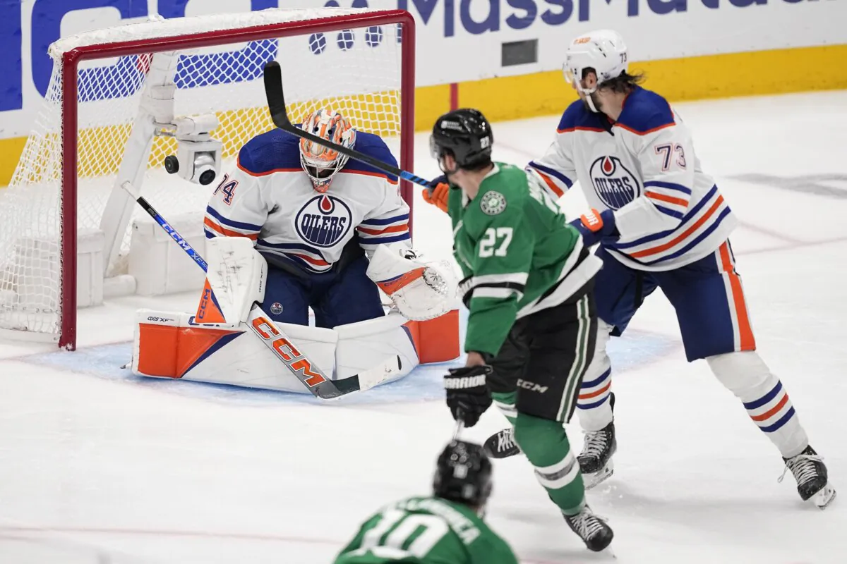 Dallas Stars left wing Mason Marchment (27) scores against Edmonton Oilers goaltender Stuart Skinner (74) as Oilers' Vincent Desharnais (73) looks on during the third period in Game 2 of the Western Conference finals in the NHL hockey Stanley Cup playoffs in Dallas on May 25, 2024. (Tony Gutierrez/AP Photo)