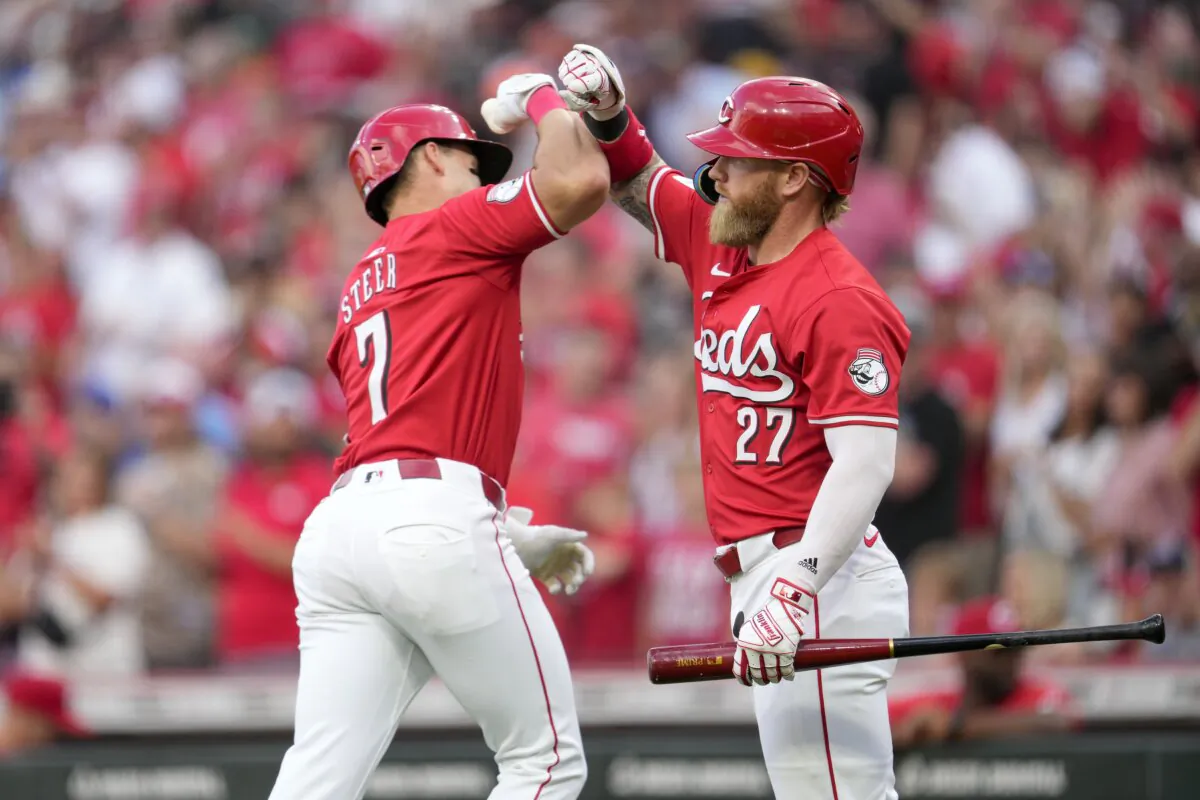 Cincinnati Reds' Spencer Steer (7) celebrates with Jake Fraley (27) after hitting a solo home run against the Los Angeles Dodgers during the first inning of a baseball game in Cincinnati on May 25, 2024. (Jeff Dean/AP Photo)