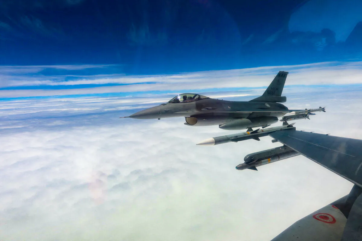 Taiwan Air Force F-16 jet fighters fly during a patrolling mission at an undisclosed location in Taiwan in this handout image taken on May 23, 2024. (Taiwan Defence Ministry/Handout via Reuters)