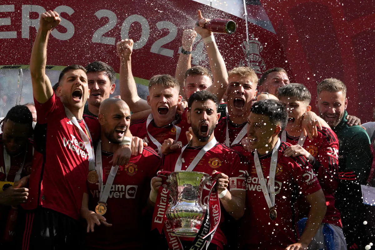 Manchester United's Bruno Fernandes holds the trophy after his team won the English FA Cup final soccer match between Manchester City and Manchester United at Wembley Stadium in London on May 25, 2024. (Kin Cheung/AP Photo)