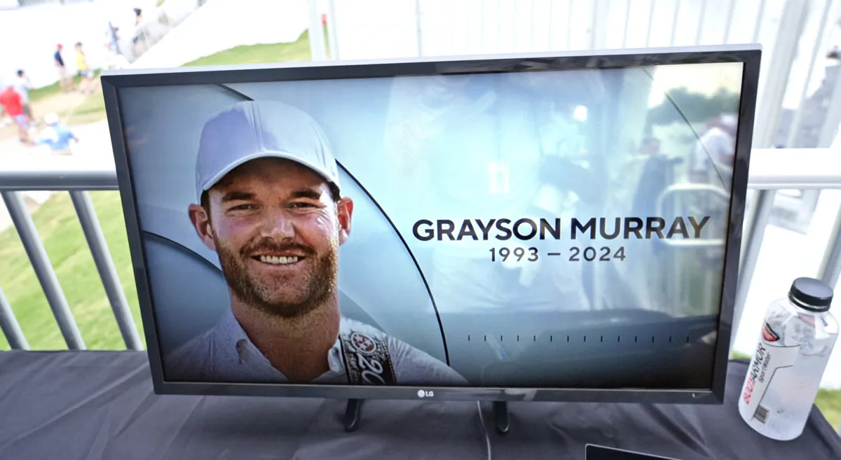 A golf television broadcast is played at the broadcast tent showing a photo of Grayson Murray during the third round of the Charles Schwab Challenge golf tournament at Colonial Country Club in Fort Worth, Texas, on May 25, 2024. (LM Otero/AP Photo)