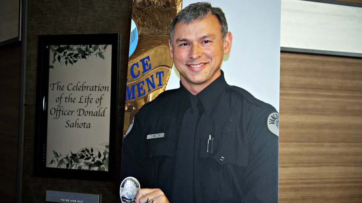Officer Vancouver Police Department officer Donald Sahota is displayed as he is honored by friends, family and colleagues at ilani Casino Resort near La Center, Wash., on Feb. 8, 2022. (Amanda Cowan/The Columbian via AP, File)