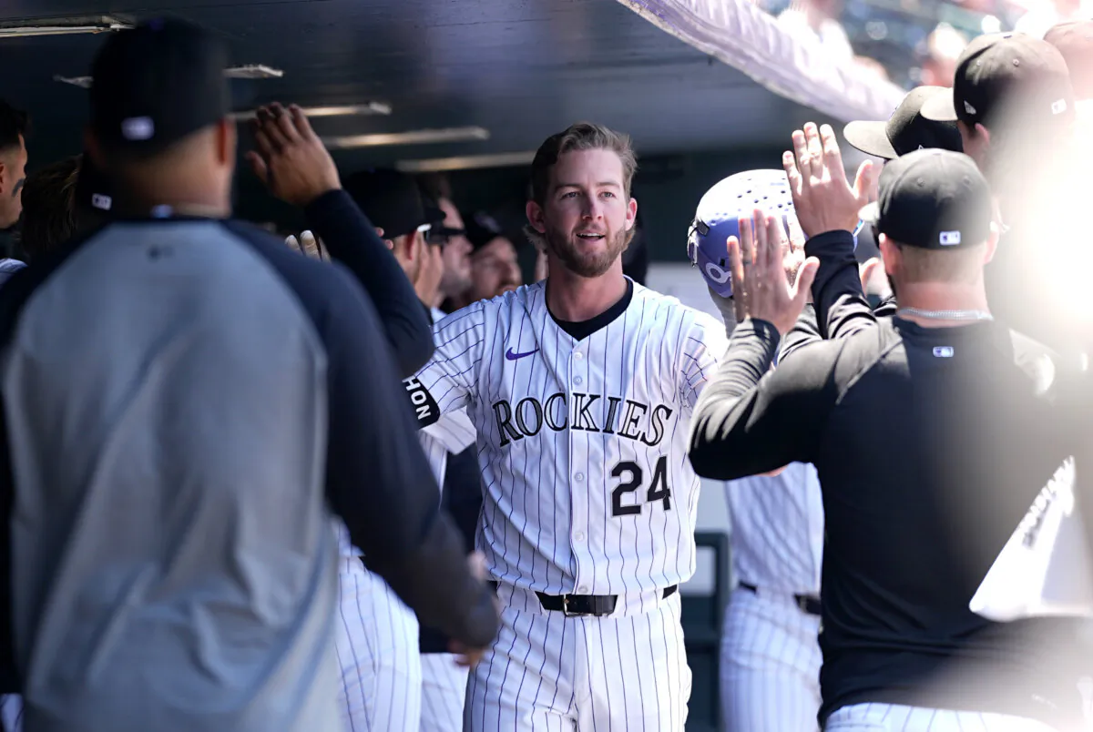 Colorado Rockies' Ryan McMahon is congratulated after hitting a two-run home run off Philadelphia Phillies starting pitcher Ranger Suárez in the first inning of a baseball game in Denver on May 26, 2024. (David Zalubowski/AP Photo)