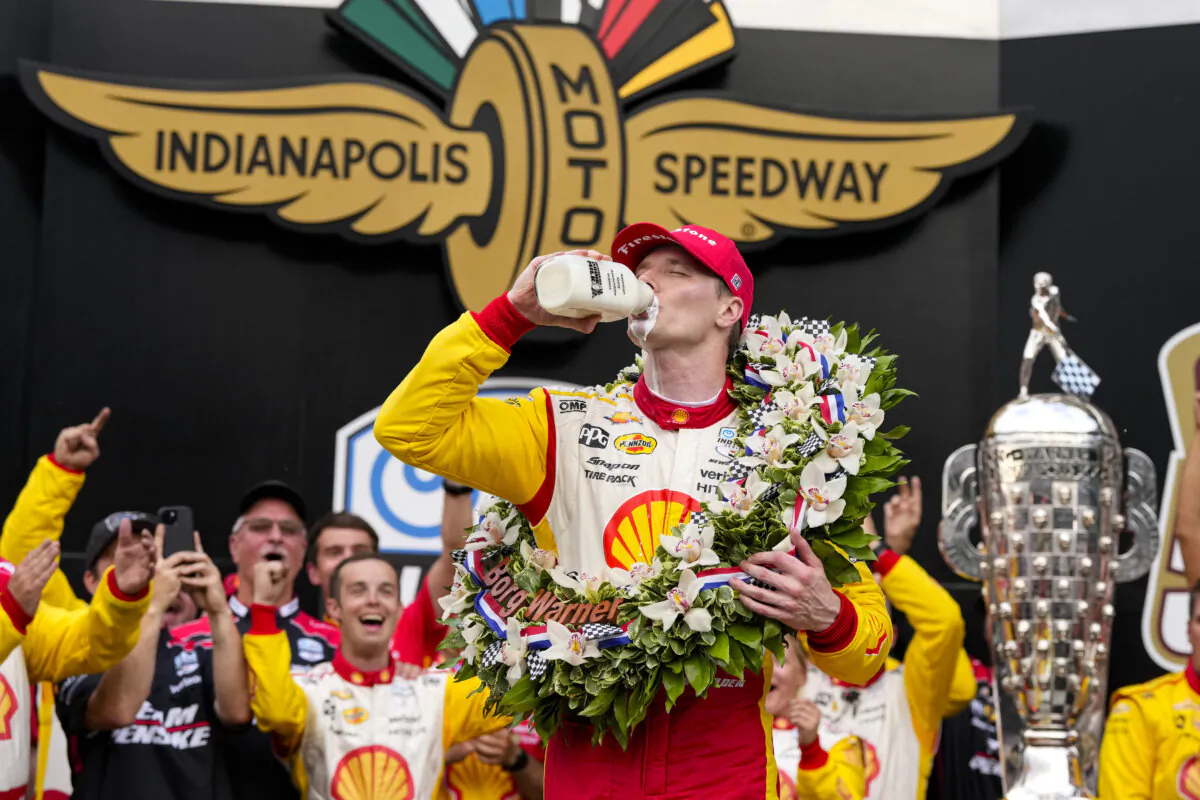 Josef Newgarden celebrates after winning the Indianapolis 500 on May 26, 2024. (Michael Conroy/AP Photo)