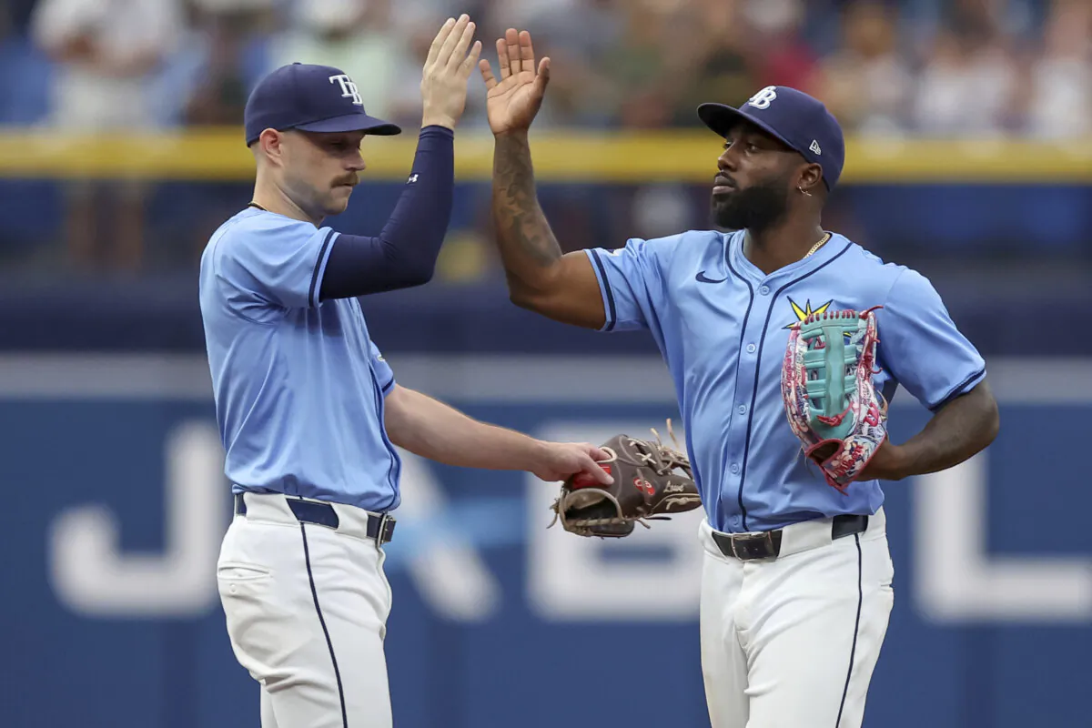 Tampa Bay Rays' Brandon Lowe (L) celebrates win over the Kansas City Royals with Randy Arozarena in a baseball game in St. Petersburg, Fla., on May 26, 2024. (Mike Carlson/AP Photo)
