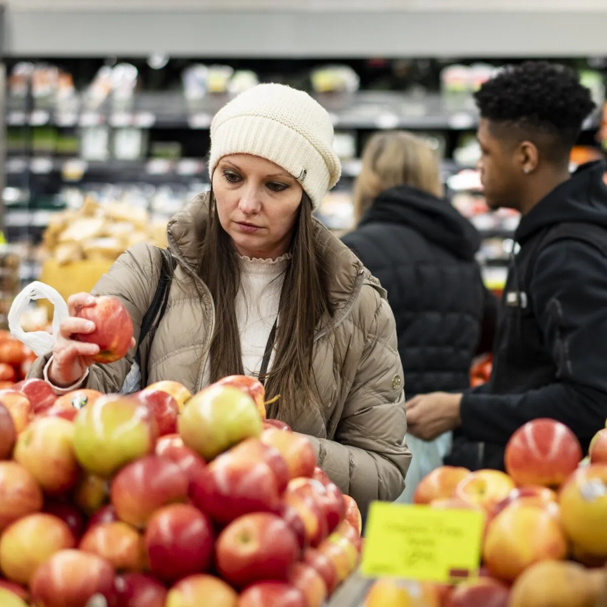 People shop at a grocery store in New York City on March 21, 2024. (Samira Bouaou/The Epoch Times)