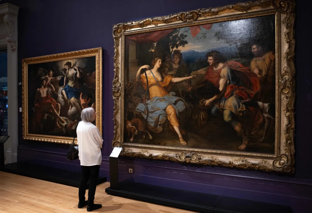 A woman views an artwork by Charles Le Brun entitled 'Atalanta and Meleager' (R) in the Renaissance Rediscovered exhibition at the Walker Art Gallery in Liverpool, England, on July 28, 2023. (Oli Scarff/AFP via Getty Images)