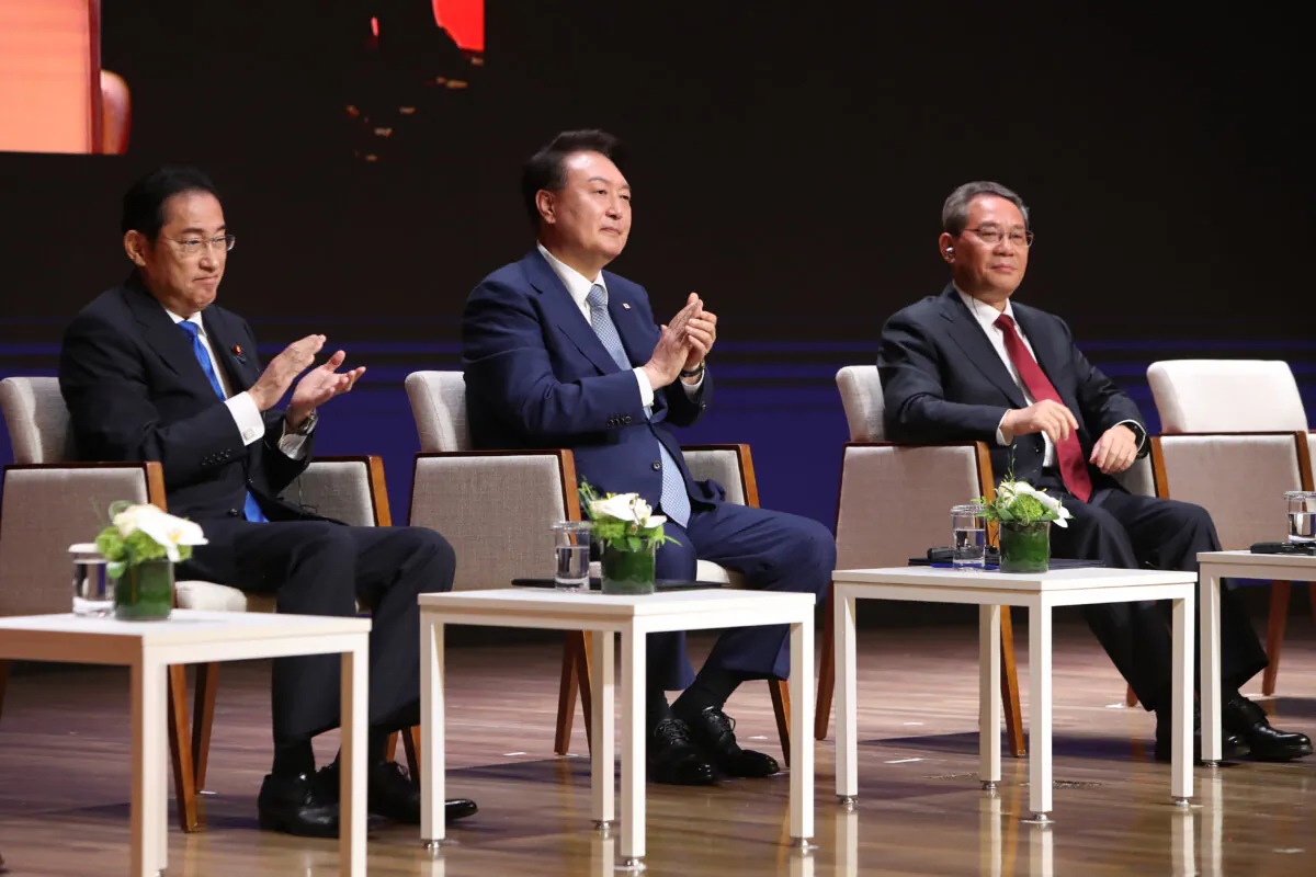(L-R) Japanese Prime Minister Fumio Kishida, South Korean President Yoon Suk-yeol, and Chinese Premier Li Qiang attend a business summit on the sidelines of a trilateral summit at Korea Chamber of Commerce and Industry in Seoul, South Korea. on May 27, 2024. (Chung Sung-Jun/Getty Images)