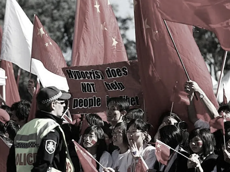 Pro-Chinese supporters wave flags during the Olympic Torch relay in Canberra, Australia. (Lisa Maree Williams/Getty Images)