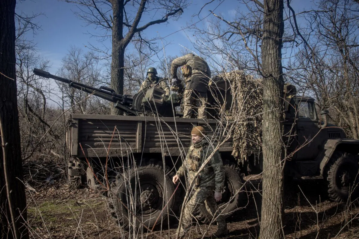 Members of Ukraine's 72nd Brigade Anti-air unit prepare a ZU-23 anti-aircraft autocannon to fire on incoming Russian drones at a frontline position near Marinka, Ukraine, on Feb. 23, 2024. (Chris McGrath/Getty Images)