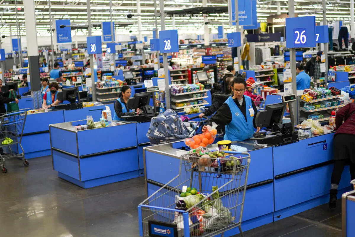 Cashiers process purchases at a Walmart Supercenter in North Bergen, N.J., on Feb. 9, 2023. (Eduardo Munoz Alvarez/AP Photo)