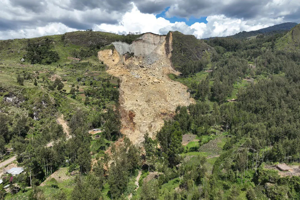 This aerial view taken on May 27, 2024 shows a general view of the area affected by a landslide in Yambali village in the region of Maip Mulitaka, in Enga Province, Papua New Guinea. (Emmanuel Eralia/AFP via Getty Images)