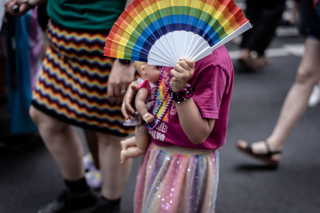 A young girl at the annual New York City Pride March in New York City on June 25, 2023. (Samira Bouaou/The Epoch Times)