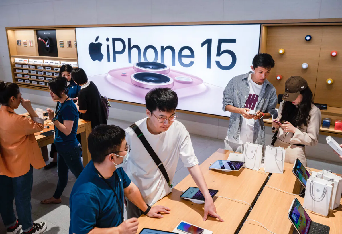 Customers at an Apple flagship store after the launch of the iPhone 15, in Beijing on Sept. 22, 2023. (Kevin Frayer/Getty Images)