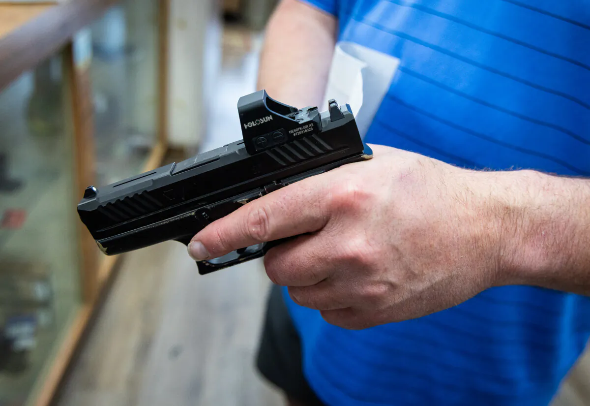Customers shop for firearms in San Diego on May 30, 2024. (John Fredricks/The Epoch Times)