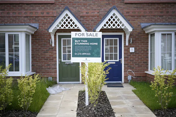 NANTWICH, ENGLAND - JUNE 22: A for sale sign is seen outside new houses on a construction development on June 22, 2023 in Nantwich, England. The Bank of England has increased the base rate to 5% today, the highest rate since 2008. (Photo by Christopher Furlong/Getty Images)