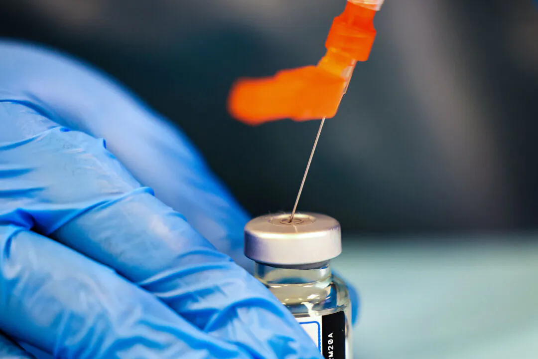 A health care worker prepares a vaccine in New York City in a file photograph. (Michael M. Santiago/Getty Images)