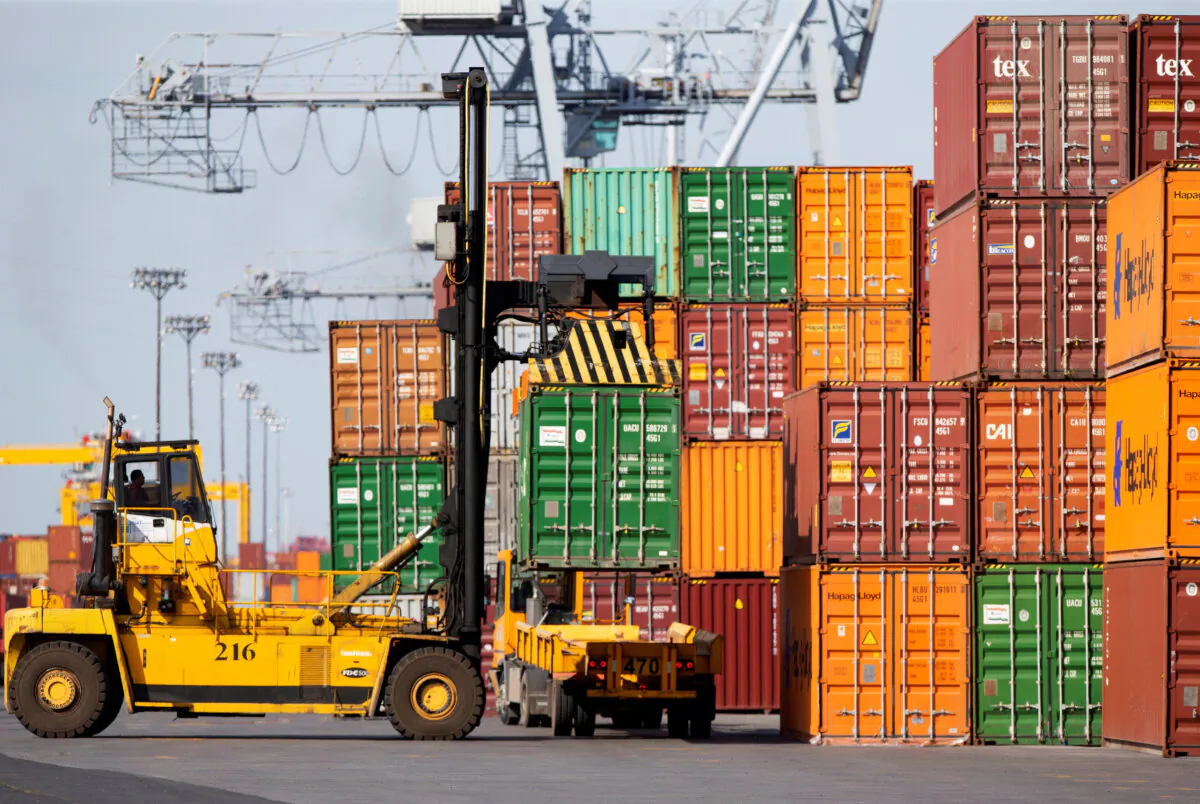 A shipping container is unloaded at the Port of Montreal, in Quebec, on May 17, 2021. (Reuters/Christinne Muschi)