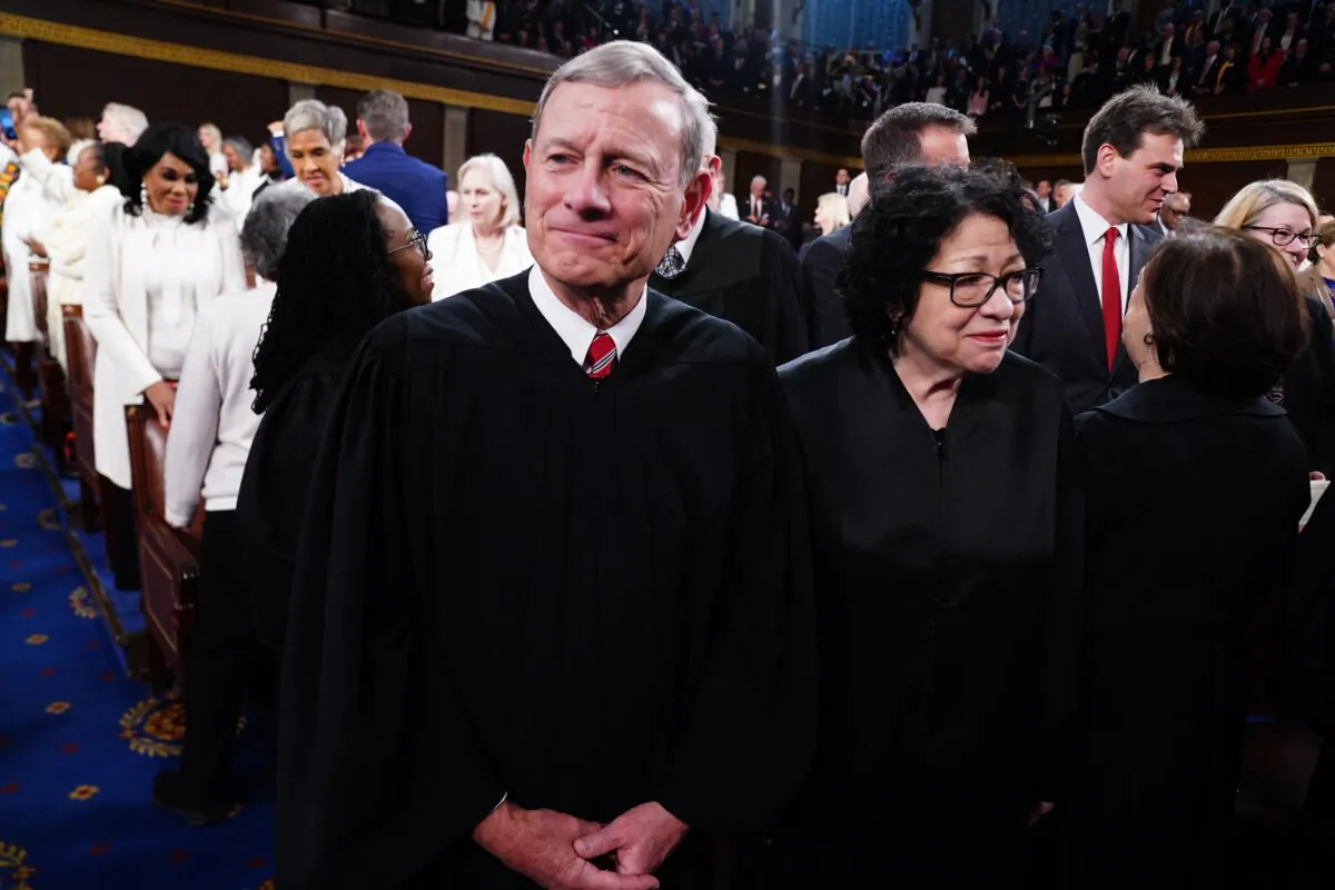 Chief Justice of the Supreme Court John Roberts (L) and Associate Justice Sonia Sotomayor (R) stand in the House of Representatives ahead of President Joe Biden's State of the Union address in the House Chamber of the US Capitol in the District of Columbia on March 7, 2024. (Shawn Thew/POOL/ AFP)