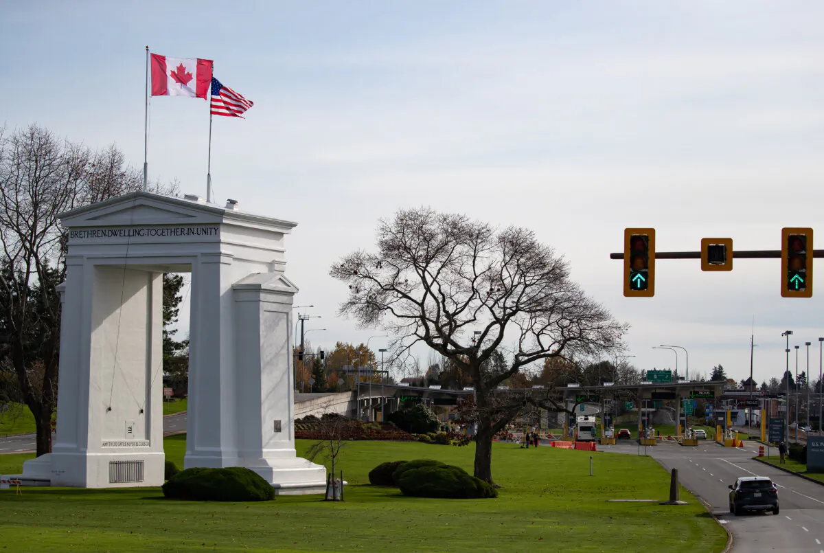 Motorists wait at U.S. Customs and Border Protection inspection booths at the Peace Arch border crossing in Blaine, Wash., across the Canada-U.S. border from Surrey, B.C., on Nov. 8, 2021. (The Canadian Press/Darryl Dyck)