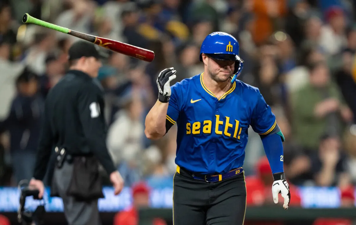 Ty France (23) of the Seattle Mariners flips his bat after hitting a solo home run during the eighth inning of a game against the Los Angeles Angels in Seattle on May 31, 2024. (Stephen Brashear/Getty Images)
