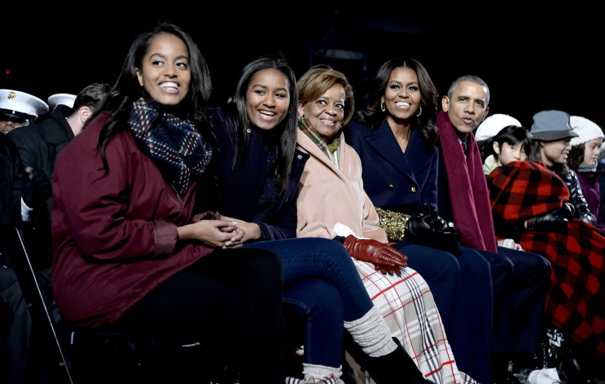 (L–R) Malia Obama, Sasha Obama, mother-in-law Marian Robinson, First Lady Michelle Obama, and President Barack Obama attend the national Christmas tree lighting ceremony on the Ellipse south of the White House on Dec. 3, 2015. (Olivier Douliery- Pool/Getty Images)