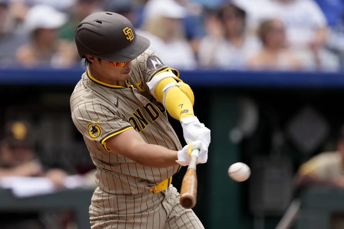 San Diego Padres' Ha-Seong Kim hits a three-run double during the fourth inning of a baseball game against the Kansas City Royals in Kansas City on June 1, 2024. (Charlie Riedel/AP Photo)