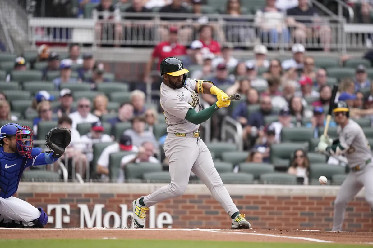 Oakland Athletics' Miguel Andujar (22) singles in the first inning of a baseball game against the Atlanta Braves in Atlanta on June 1, 2024. (Brynn Anderson/AP Photo)