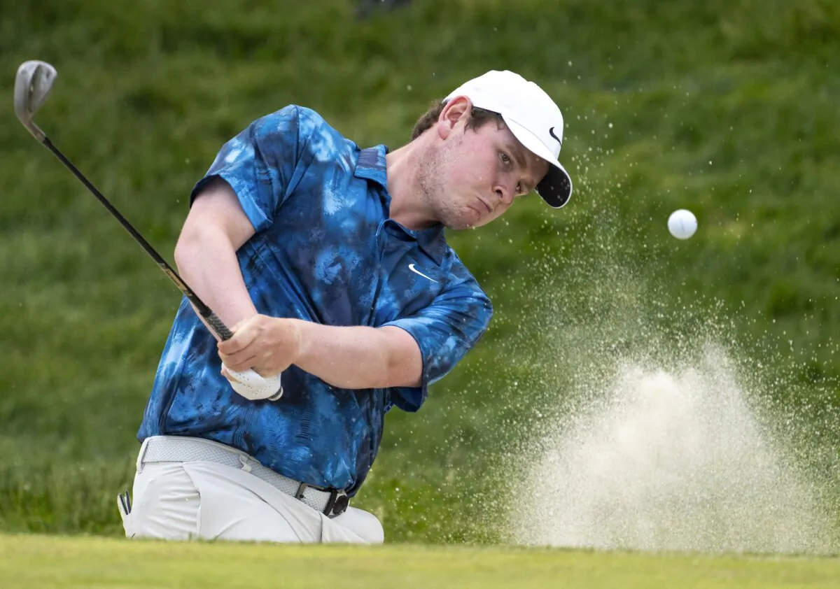 Robert MacIntyre, of Scotland, hits out of a bunker on the eighth hole during the third round of Canadian Open golf tournament in Hamilton, Ontario,  on June 1, 2024. (Frank Gunn/The Canadian Press via AP)