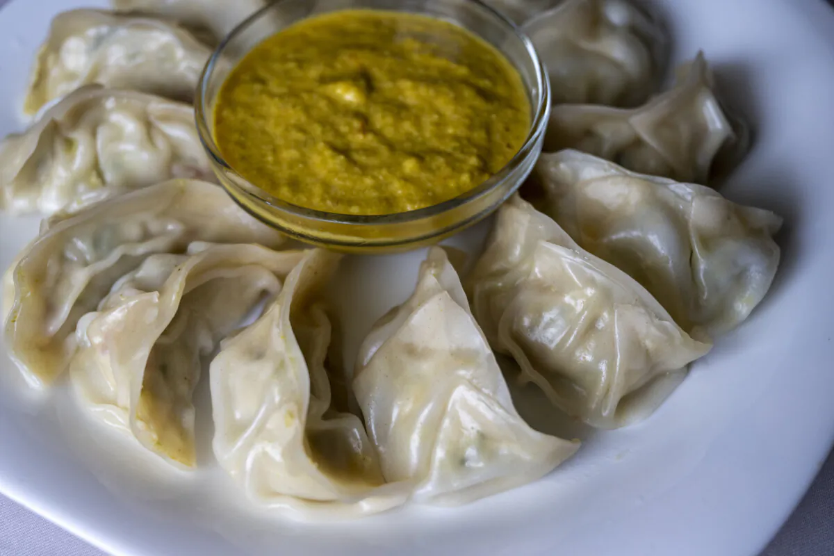 Radhika Acharya’s dumplings and chutney sauce on Thursday, April 11, 2024, in Pittsburgh. (Benjamin B. Braun/Pittsburgh Post-Gazette/TNS)
