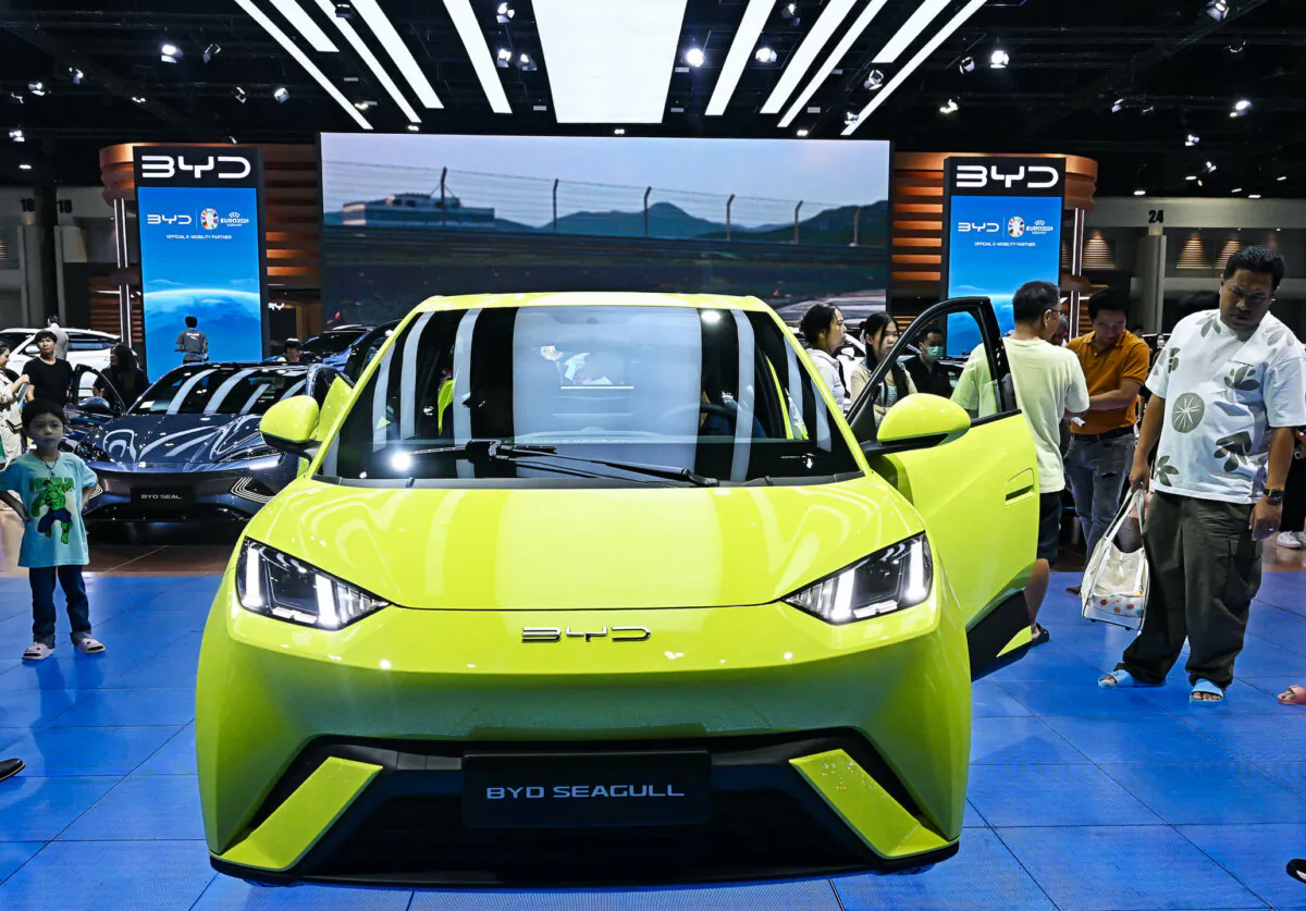 People look at a BYD Seagull car by Chinese electric vehicle (EV) manufacturer BYD Auto at the Bangkok International Motor Show in Nonthaburi, Thailand, on March 27, 2024. (Lillian Suwanrumpha/AFP via Getty Images)