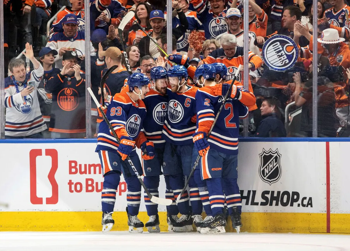 Connor McDavid (C) and Edmonton Oilers teammates celebrate a first-period goal against the Dallas Stars in Game 6 of the NHL Western Conference final in Edmonton, Canada on June 2, 2024. (Jason Franson/The Canadian Press via AP)