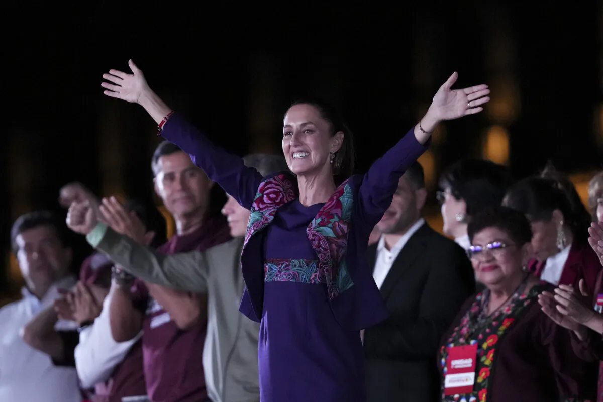 President-elect Claudia Sheinbaum waves to supporters at the Zocalo, after the National Electoral Institute announced she held an irreversible lead in the election in Mexico City's main square on June 3, 2024. (Marco Ugarte/AP Photo)