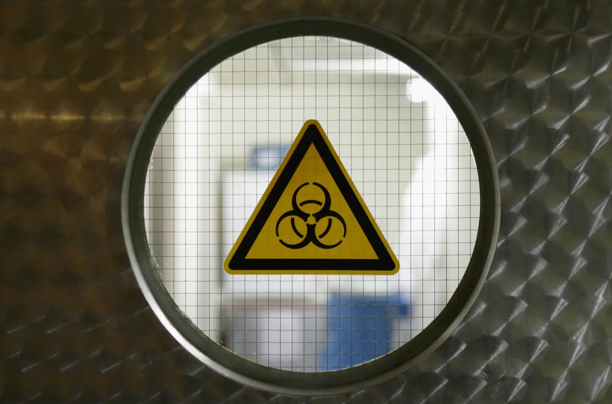 A biohazard sign is pictured on a lab entrance door in Berlin, Germany, in a file photo. (Andreas Rentz/Getty Images)