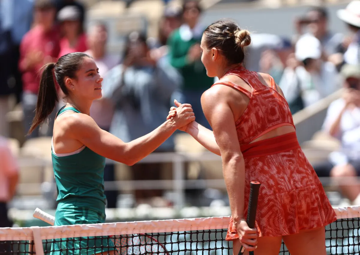 Emma Navarro of the United States (L) shakes hands with Aryna Sabalenka after her defeat in a women's singles fourth-round match during the French Open in Paris on June 3, 2024. (Dan Istitene/Getty Images)