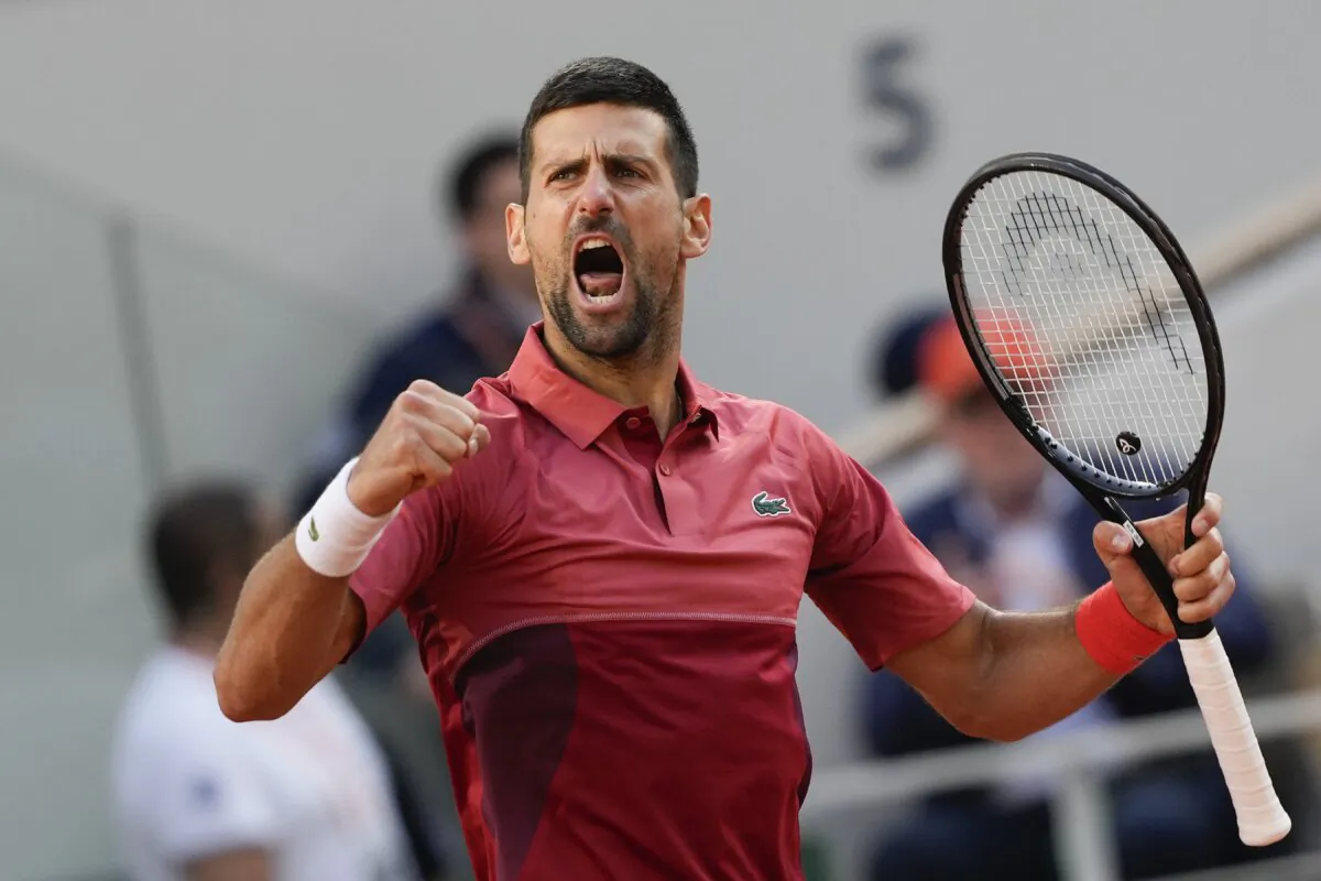 Serbia's Novak Djokovic clenches his fist after holding his service game and reaching 5-5 in the fourth set during his fourth round match of the French Open tennis tournament against Argentina's Francisco Cerundolo in Paris, Monday, June 3, 2024. (Thibault Camus/AP Photo)