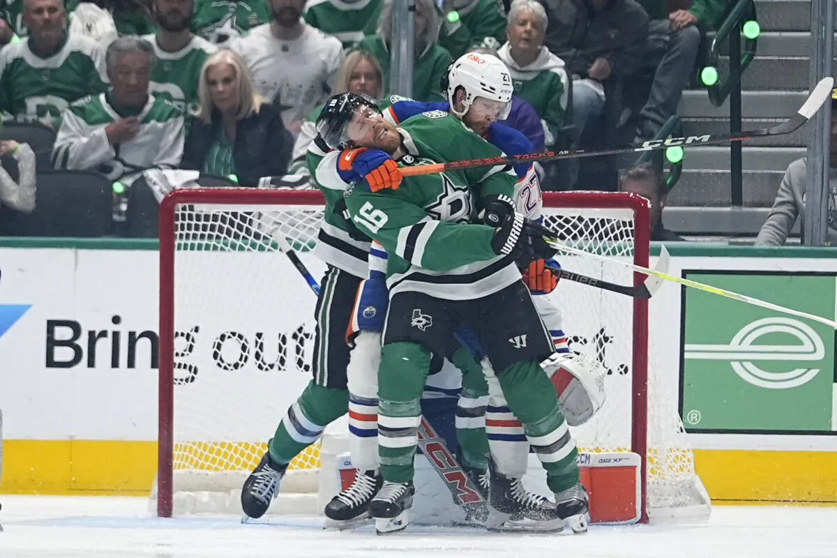 Dallas Stars center Joe Pavelski (16) and Edmonton Oilers defenseman Brett Kulak (27) tangle in front of the Edmonton net during Game 5 of the NHL Western Conference final in Dallas on May 31, 2024. (Julio Cortez/AP Photo)