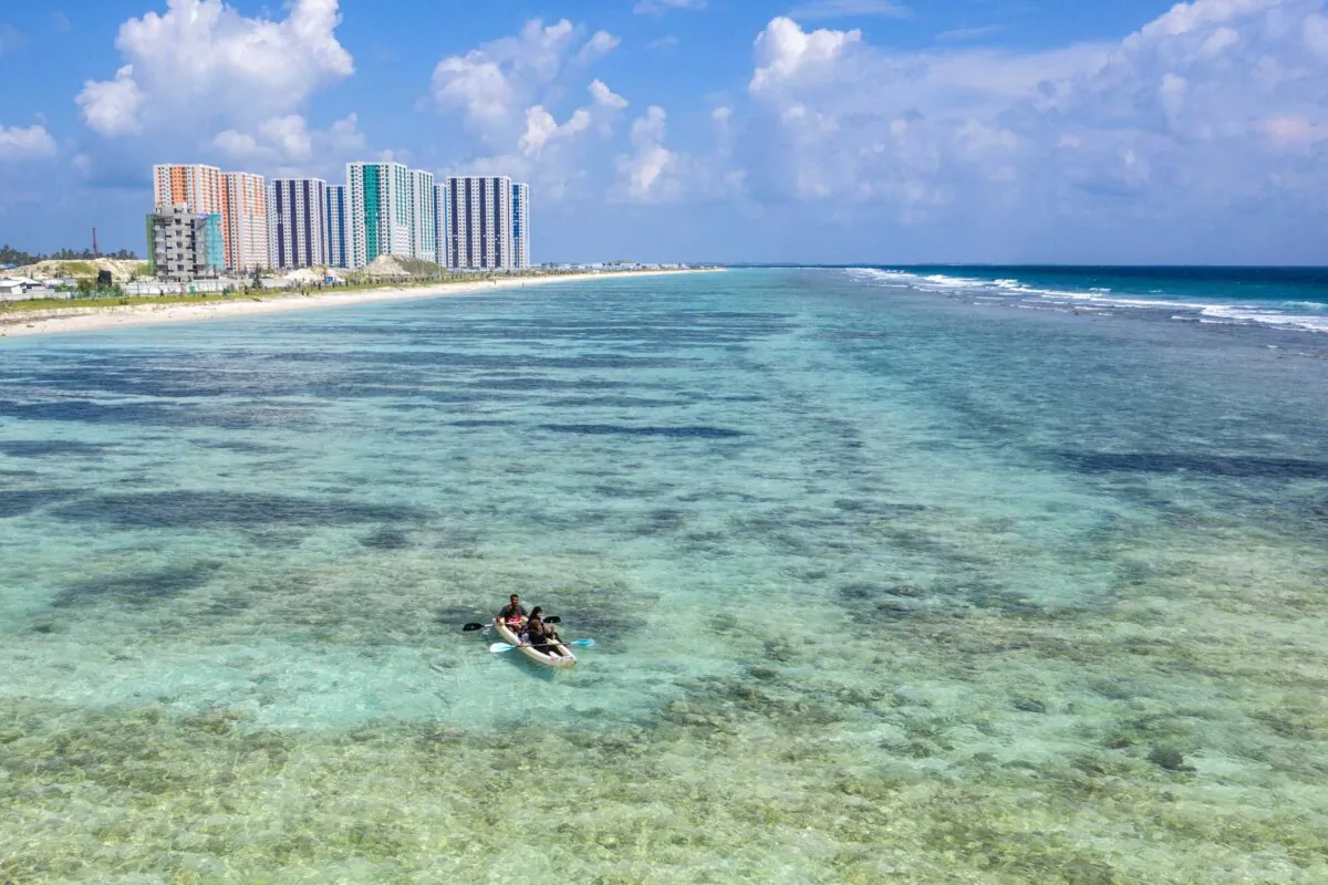 People kayak in the sea off Hulhumale next to the capital city of Male, in the Maldives on Dec. 13, 2019. (Carl Court/Getty Images)