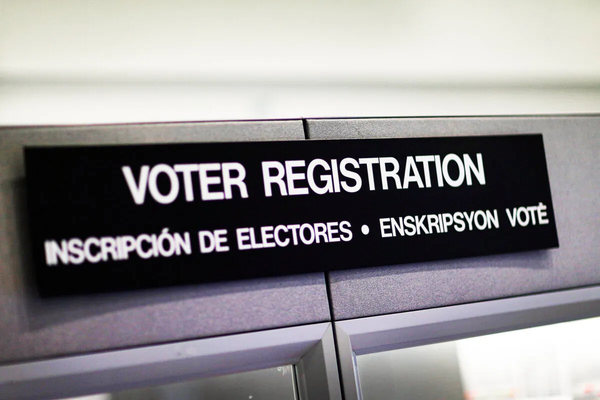 A voter registration sign hangs at the Miami-Dade elections office in Miami on Oct. 1, 2012. (Joe Raedle/Getty Images)